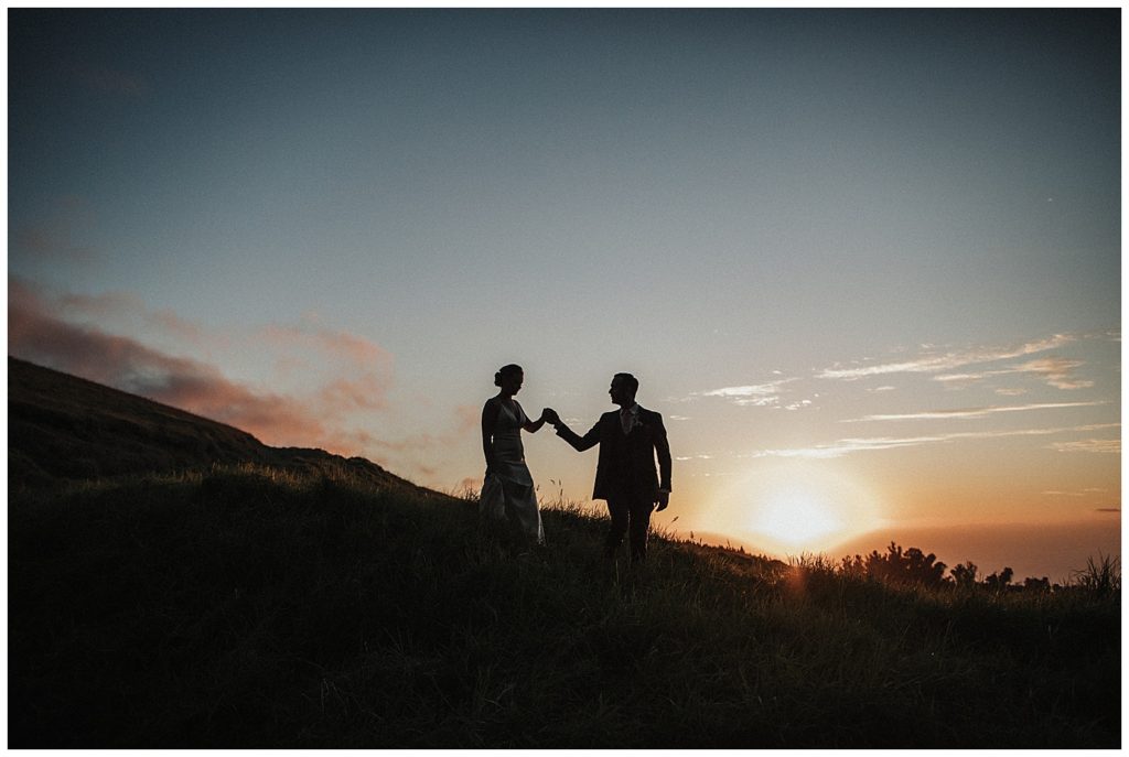 Maui wedding couple walking together on a hill in Kula Hawaii