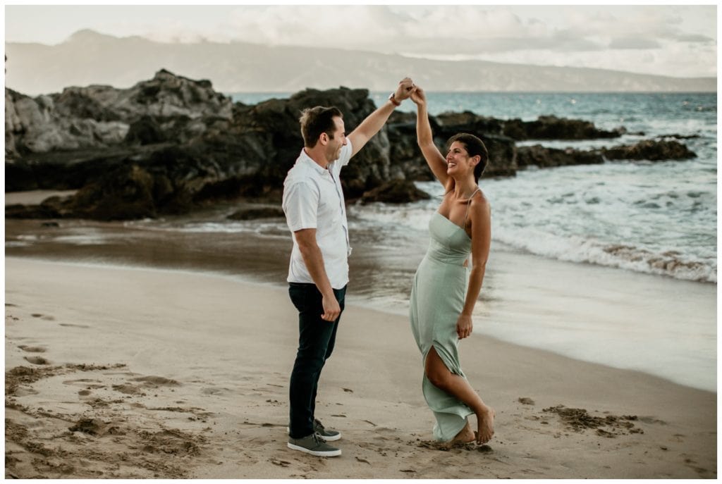 Maui proposal photographer Amy Jayne Photography  captured this surprise proposal in Kapalua Maui on the cliffs with the couple on the beach