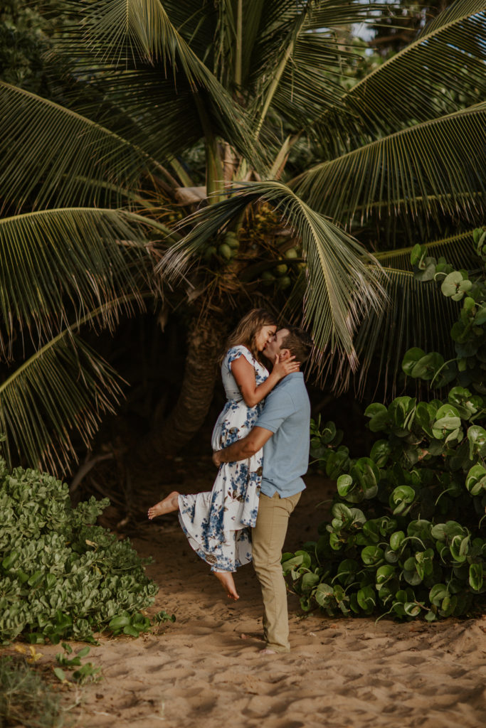 Maui Engagement Photos couple kissing on the sand, outfit inspiration what to wear.