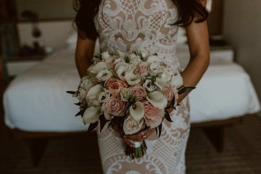 Closeup of Bride holding white and pink bouquet