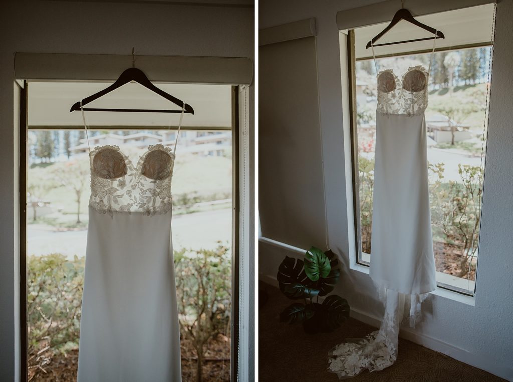 Detail shot of wedding dress hanging in front of window