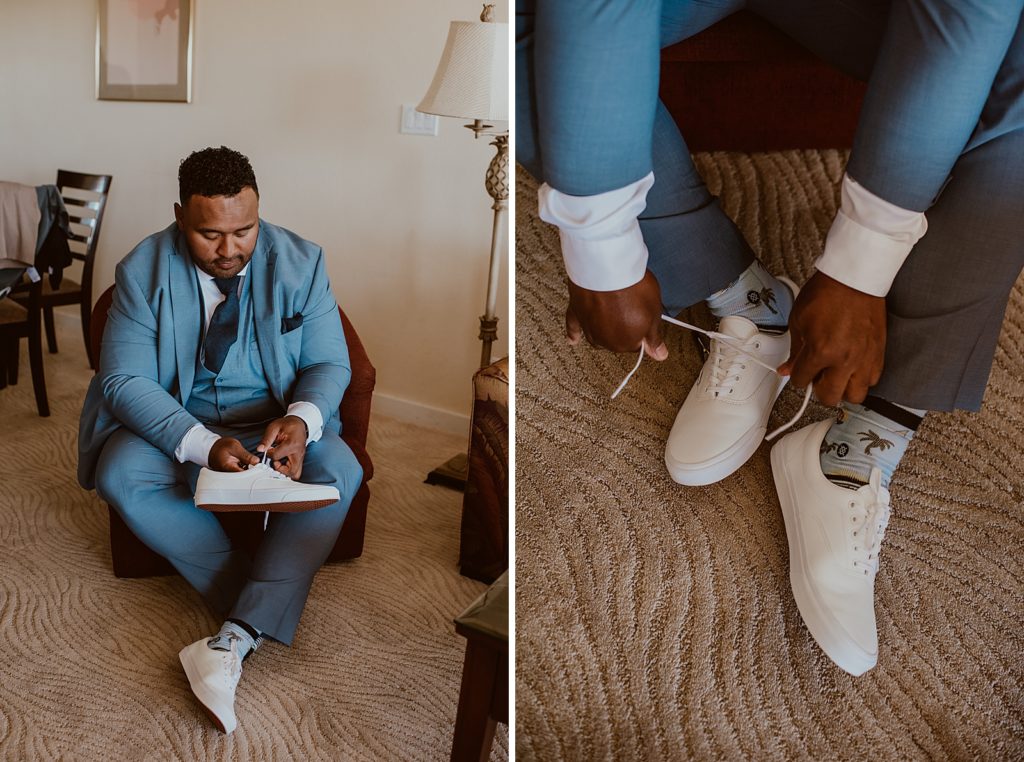 Groom getting ready putting on white sneakers