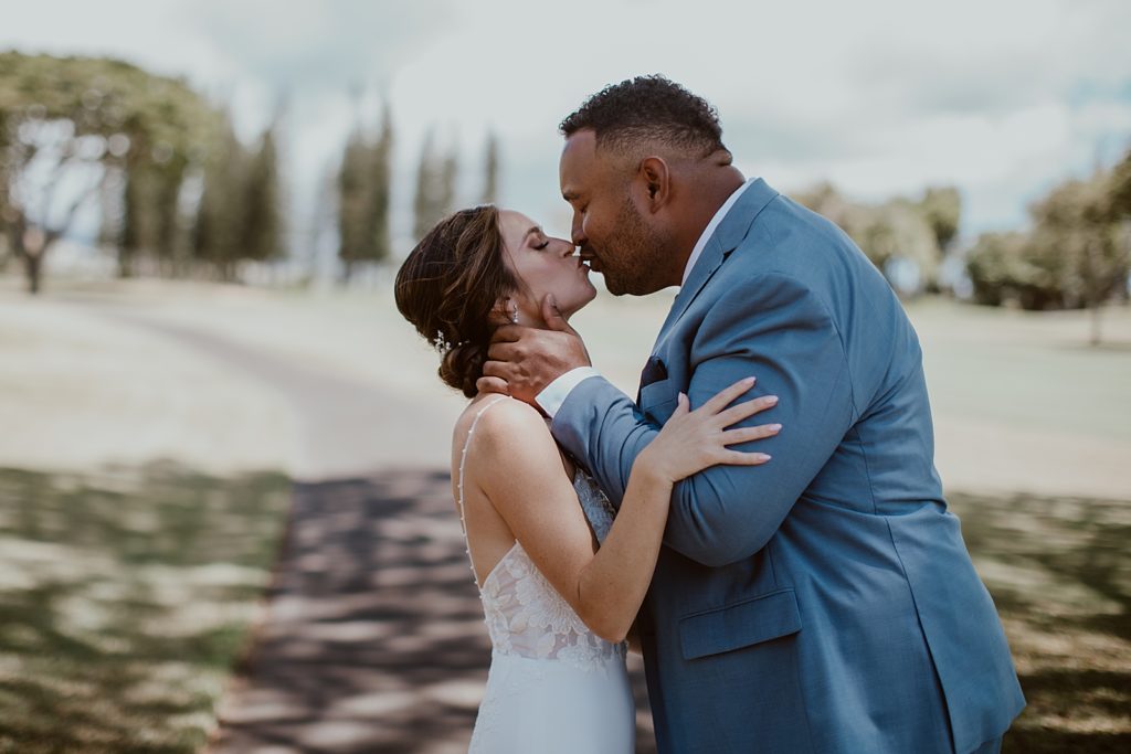 Portrait of bride and Groom kissing