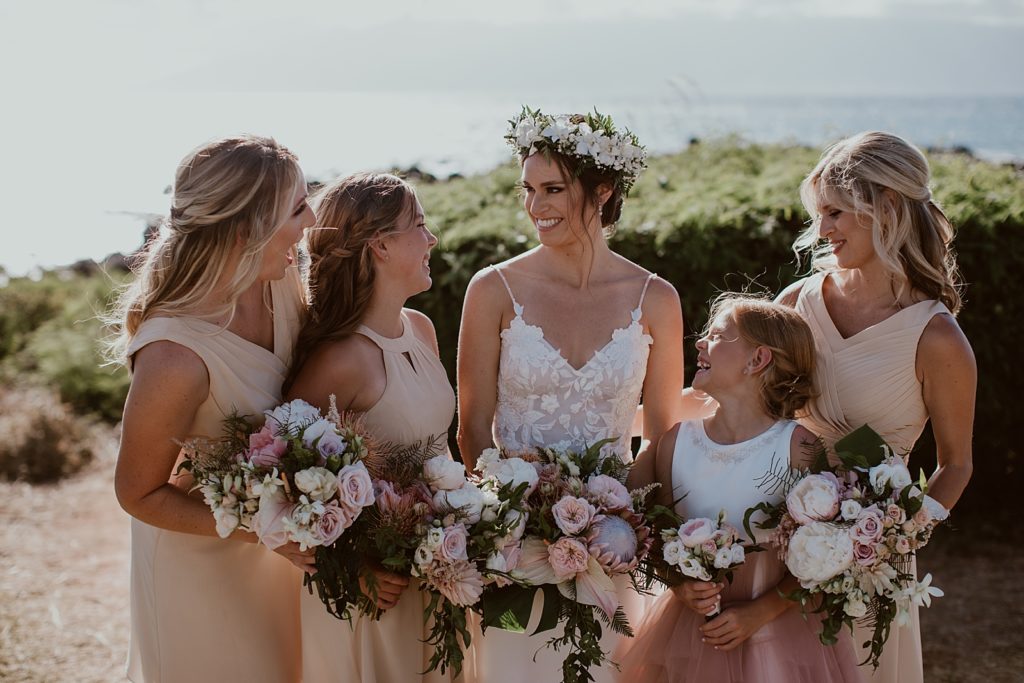 Bride with bridal crown and Bridesmaids and fower giel with bouquets