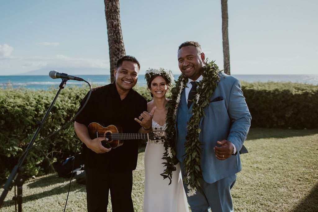 Bride and Groom portrait with musician