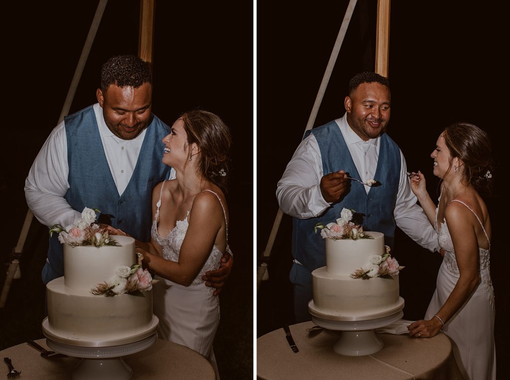 Bride and Groom giving each other a bite of cake for nighttime Reception