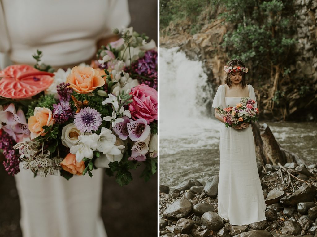 Bride with colorful bouquet and floral crown in front of waterfall