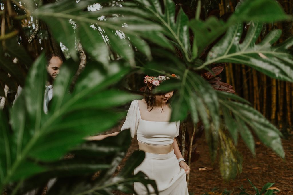 Bride and Groom portrait with green leaf obstructing photo