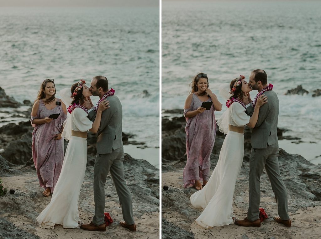 Just married Bride and Groom kissing in front of ocean water