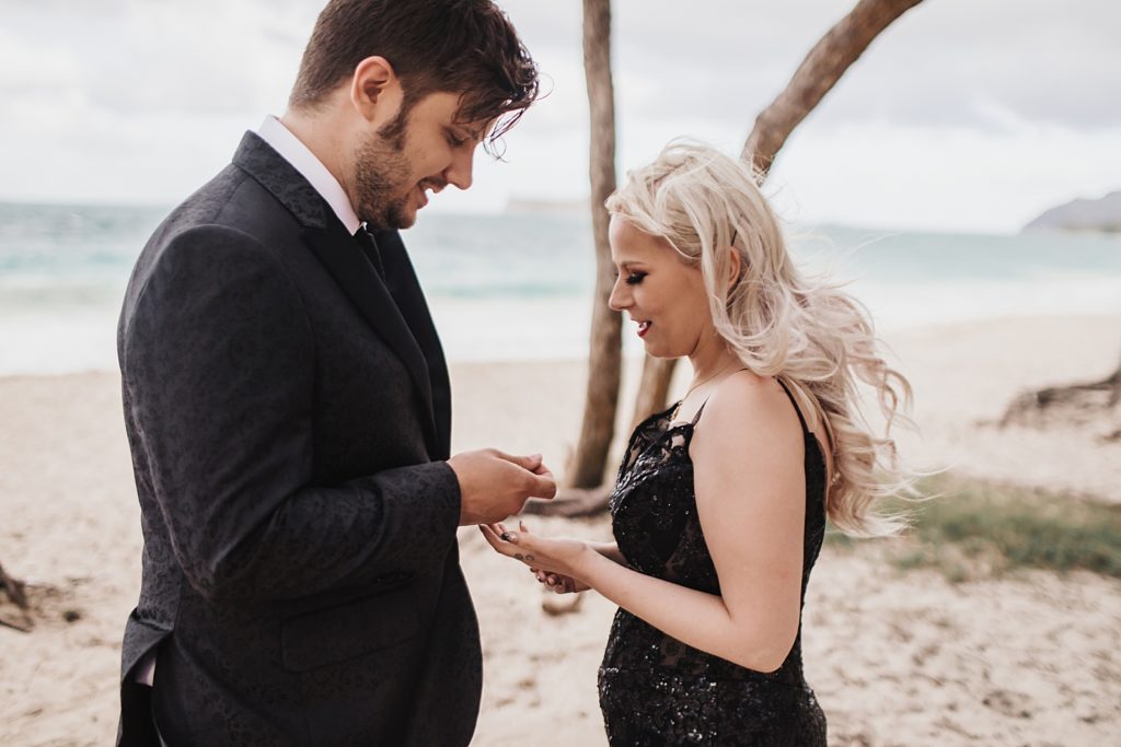 Bride and Groom exchanging rings on the beach