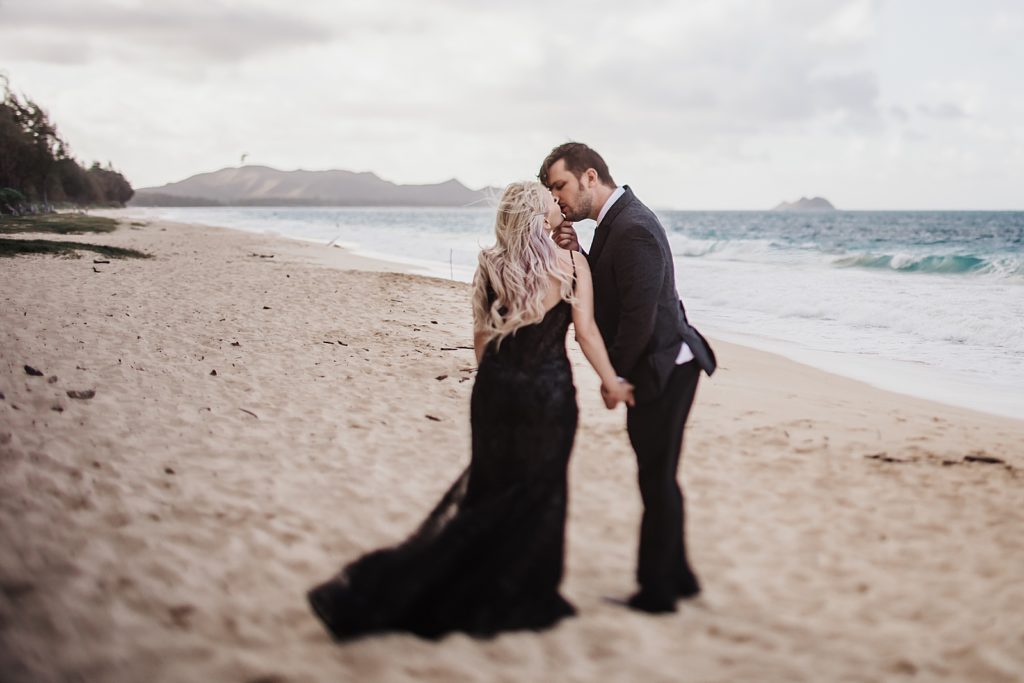 Bride and Groom leaning in for a kiss on the beach