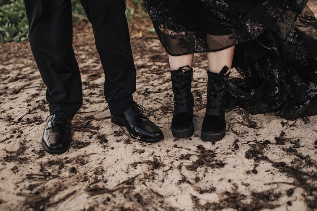 Closeup of Bride and Groom's shoes on the sand