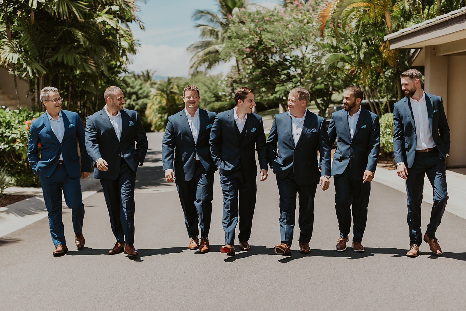 Groom and groomsmen walking casually outside together