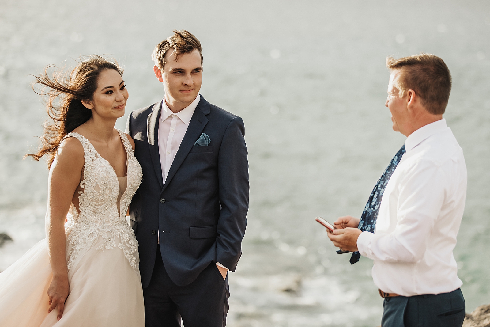 Bride and Groom standing side by side for seaside Elopement Ceremony with Officiant