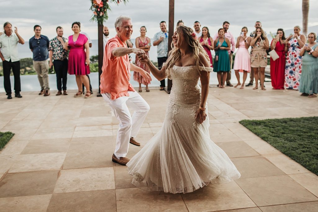Father daughter fun dance for outdoor reception by the water