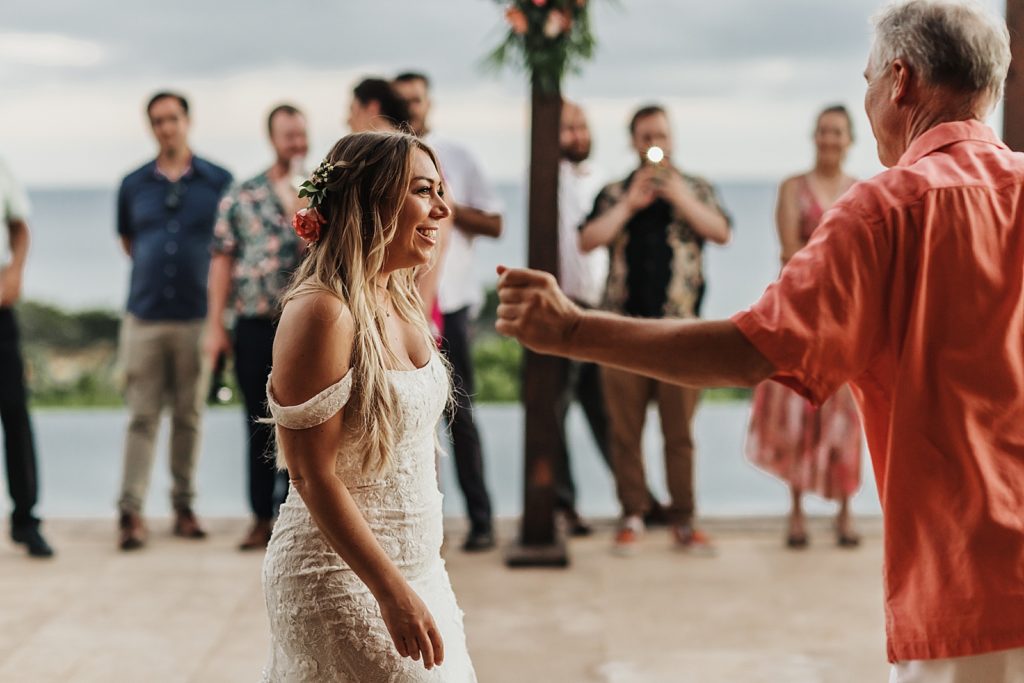 Bride after dancing with father at outdoor Reception