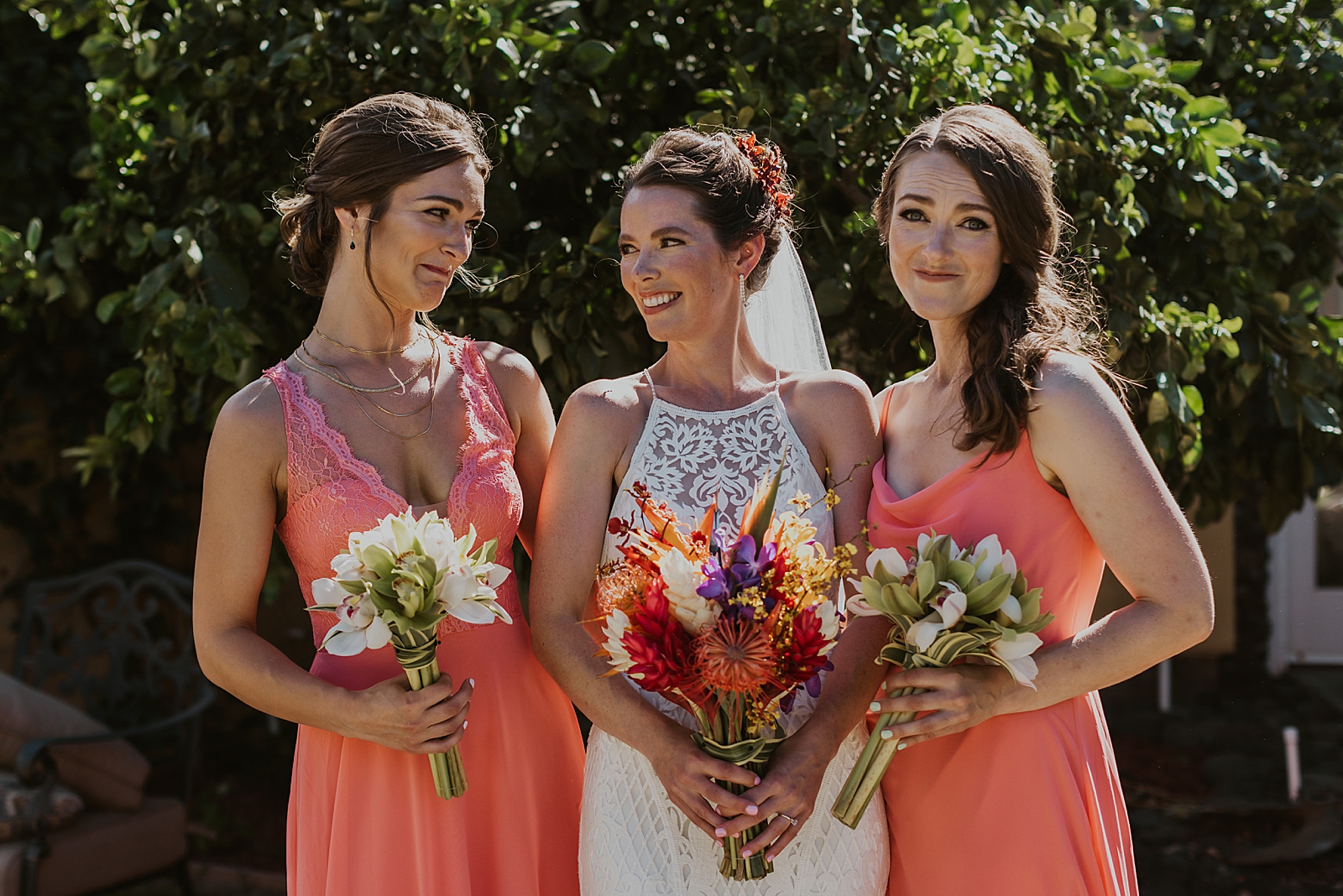 Bride with Bridesmaids holding tropical bouquets