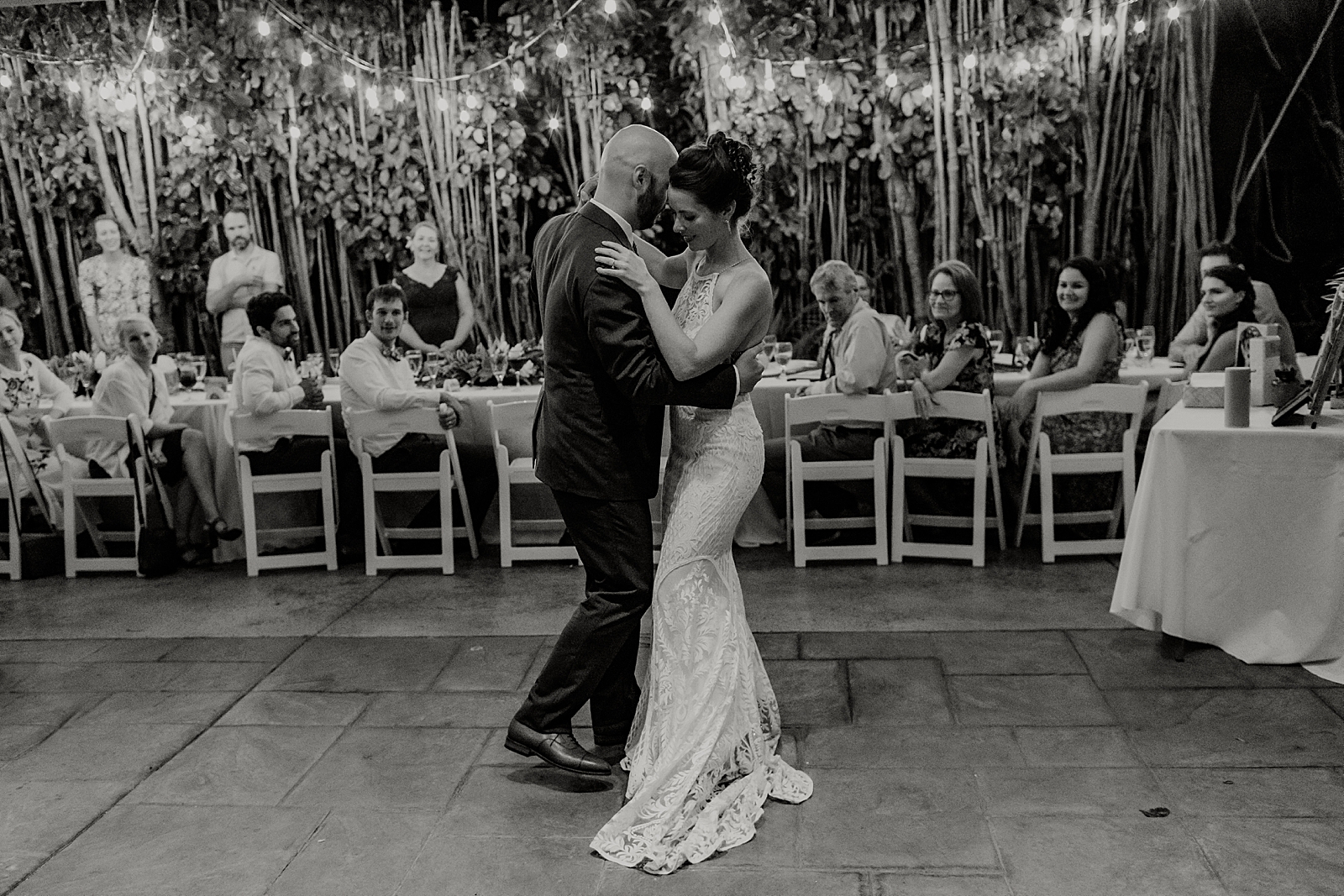 B&W Bride and Groom dancing for first dance during outdoor Reception
