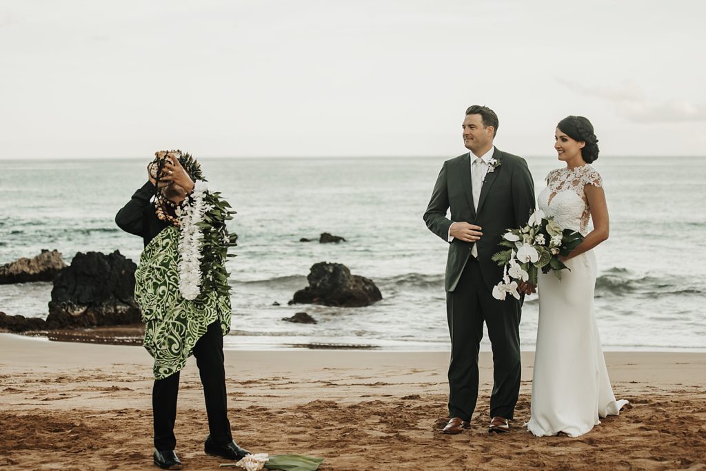 Officiant starting the elopement Ceremony by the ocean 