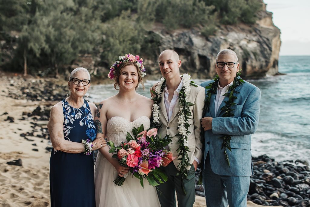 Bride and Groom with parents on opposite sides for beach side Ceremony