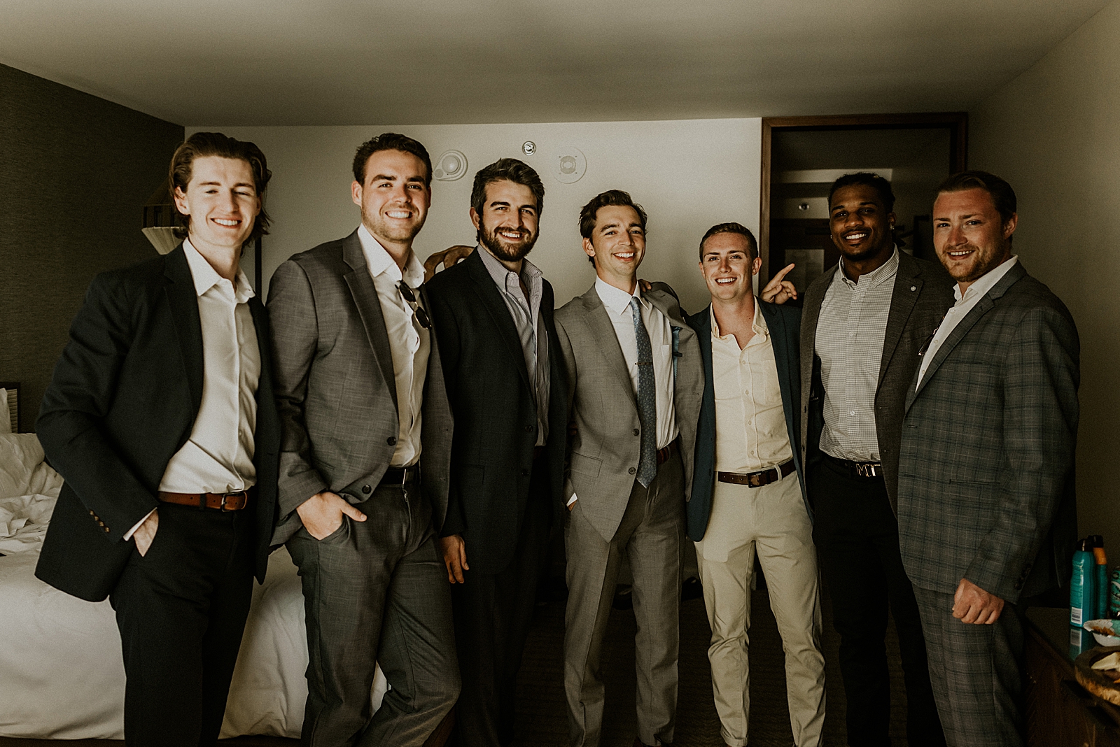 Groom with Groomsmen after getting ready in hotel room