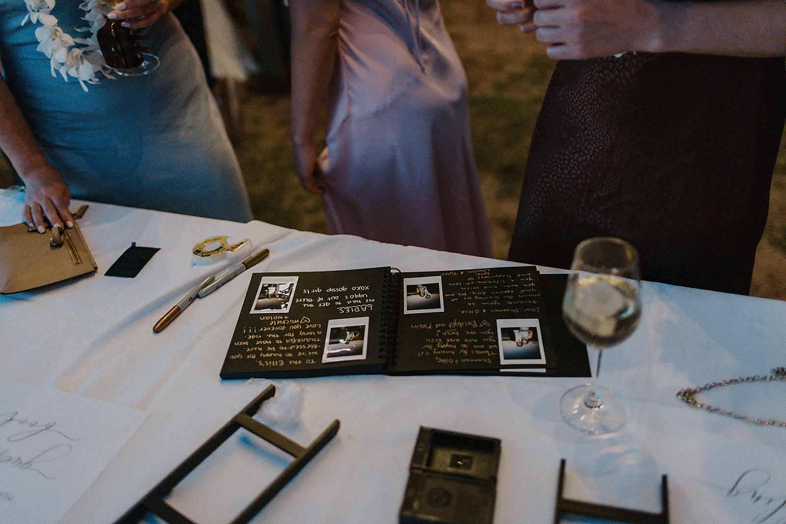 Detail shot of wedding book with Polaroid pictures