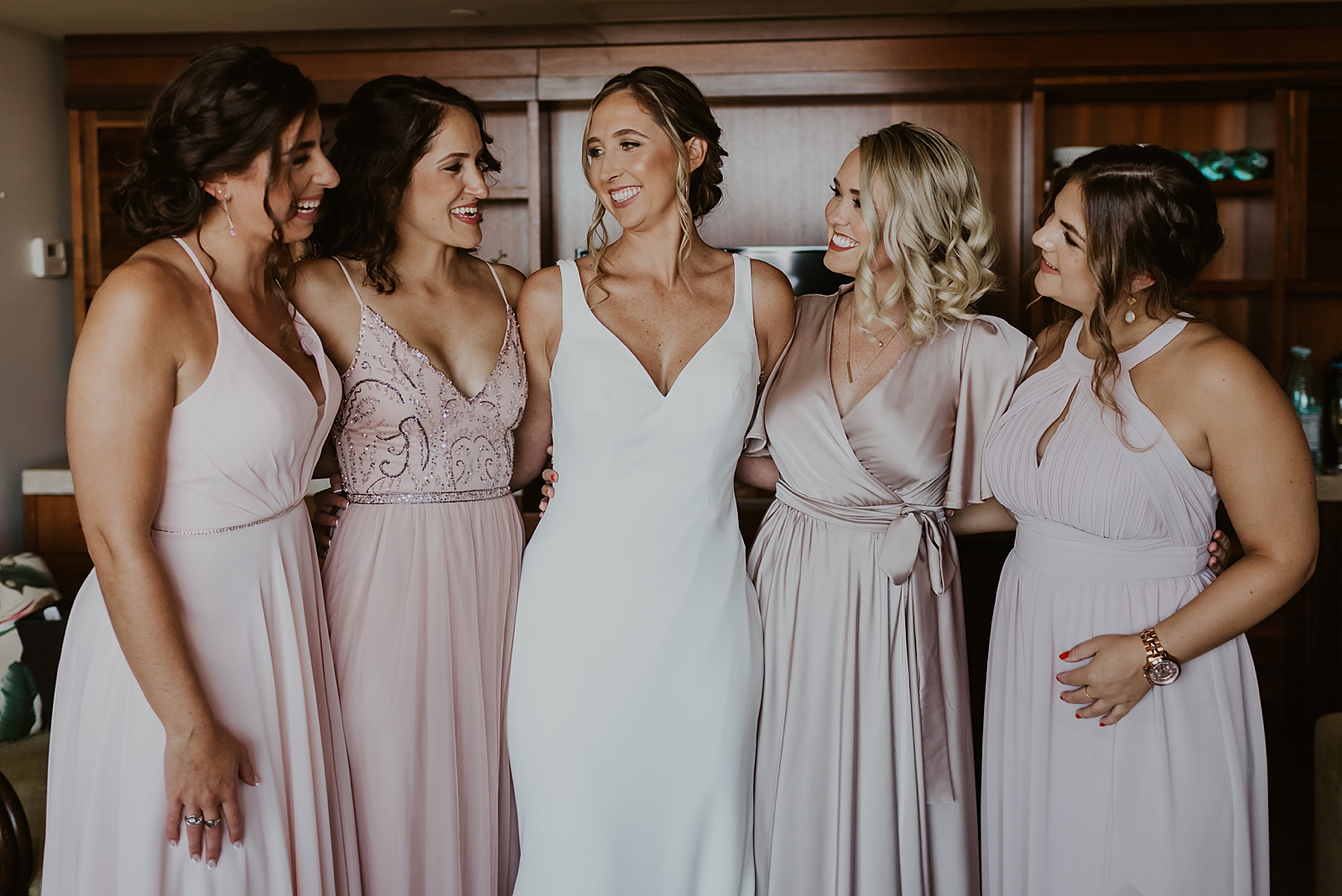 Bride with Bridesmaids after getting ready inside