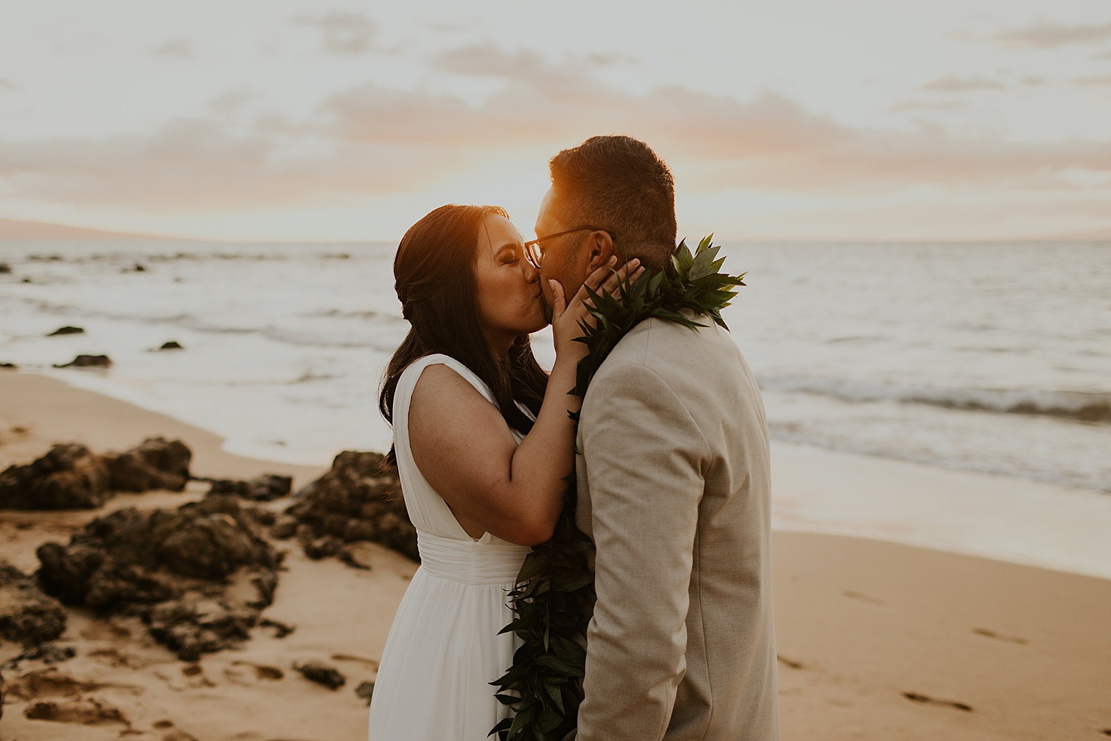 Bride and Groom kissing on the beach