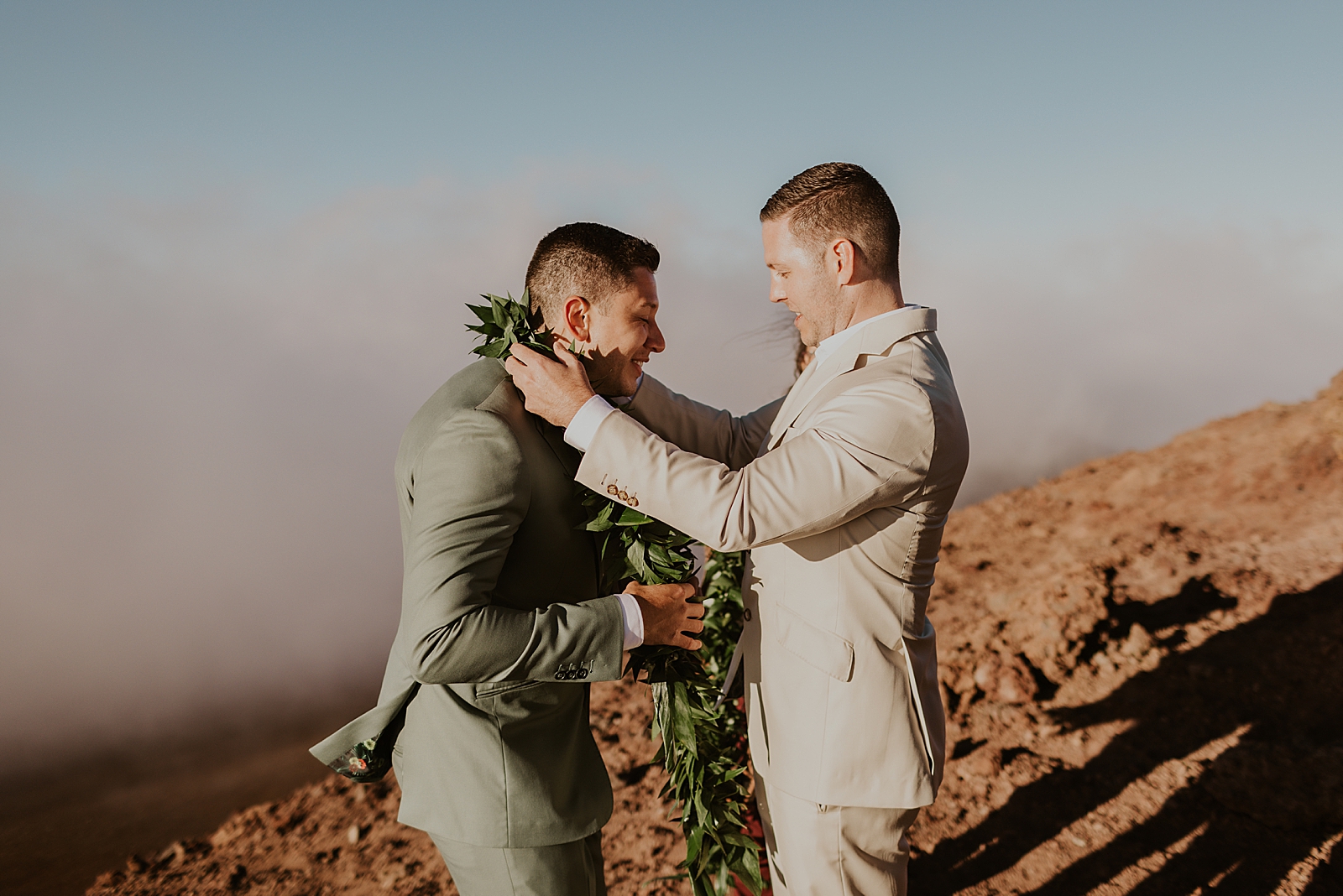 Grooms putting leis on each other for Elopement Ceremony