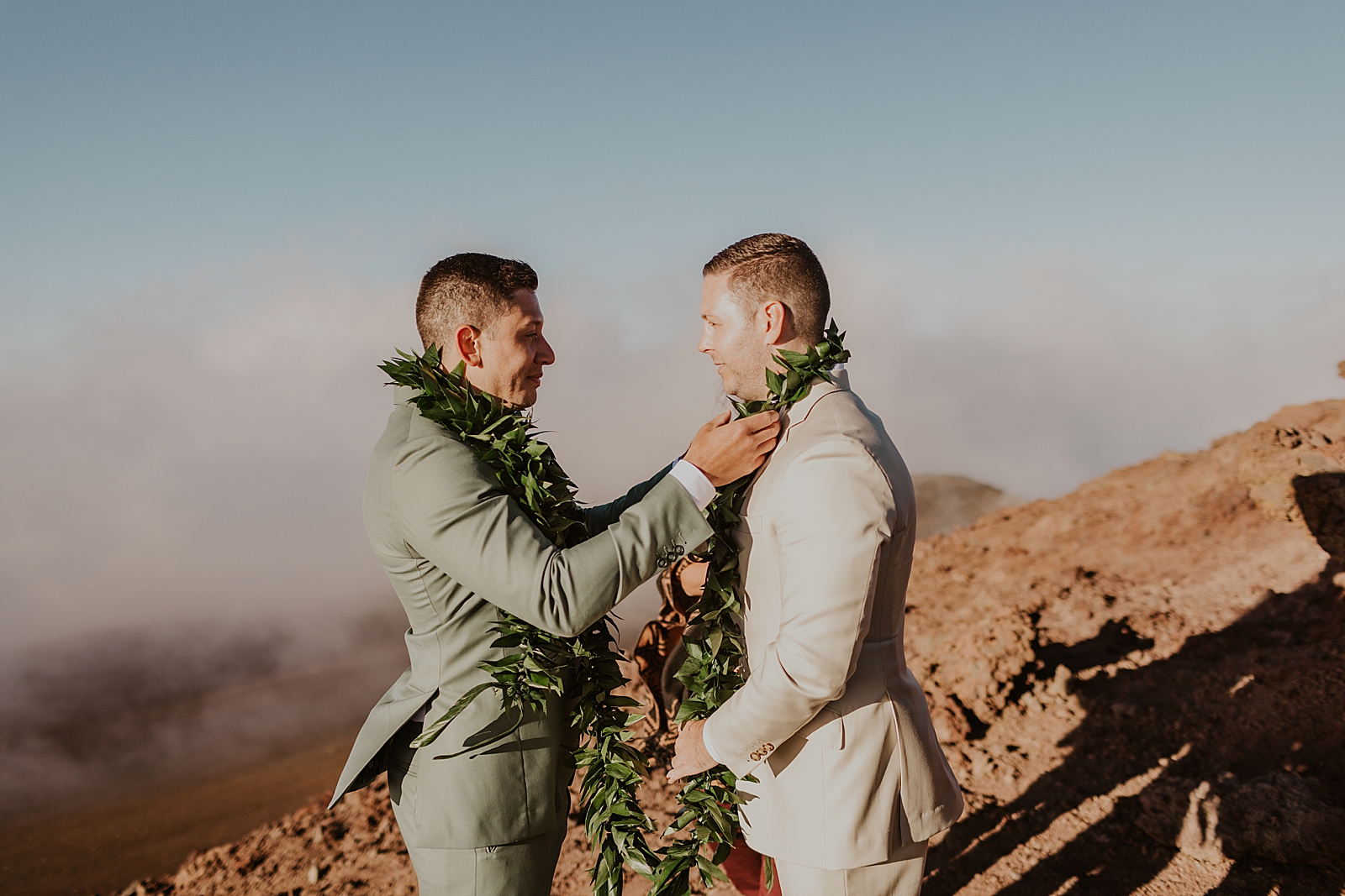 Grooms putting leis on each other for Elopement Ceremony