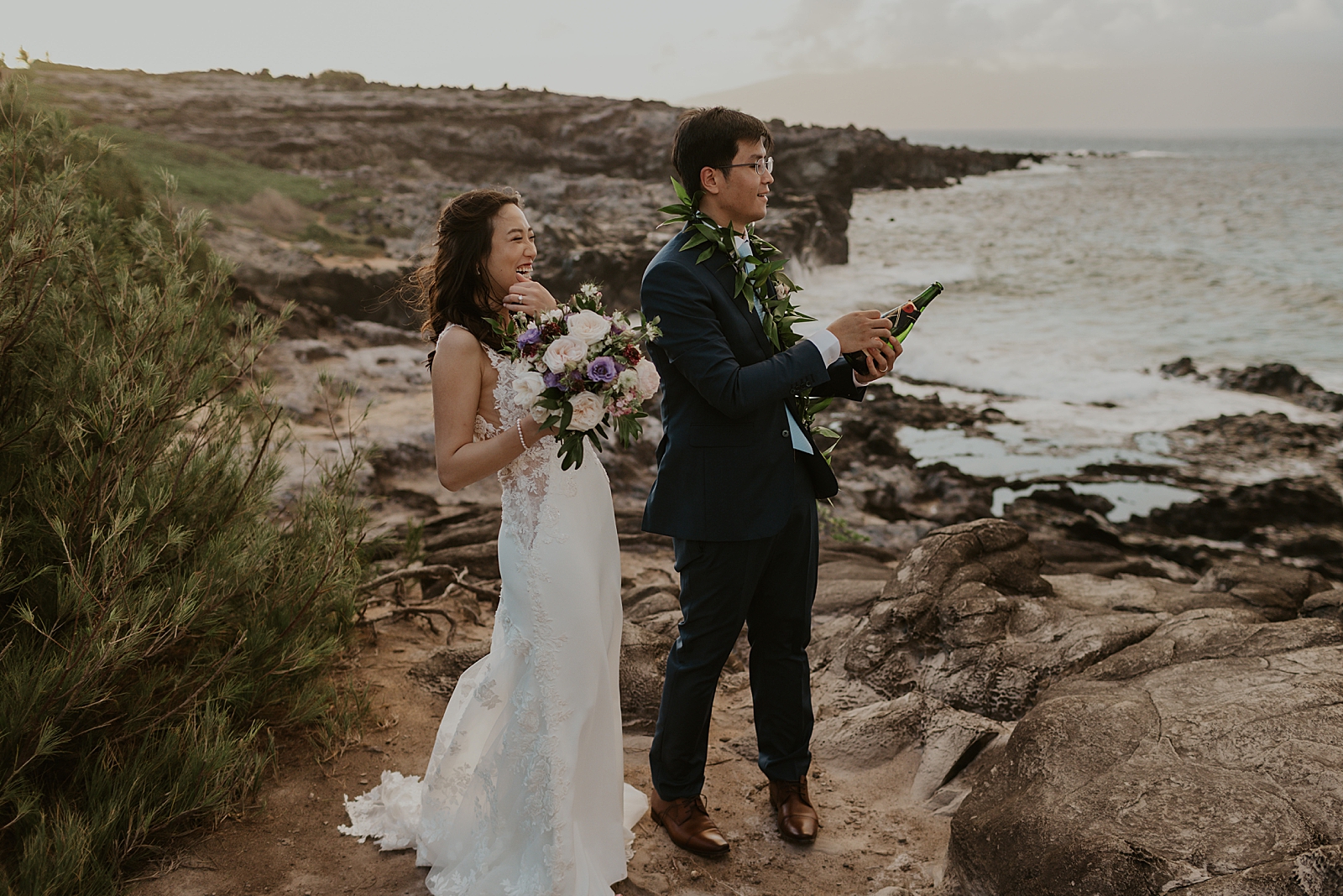 Bride and Groom popping Champaign by the ocean