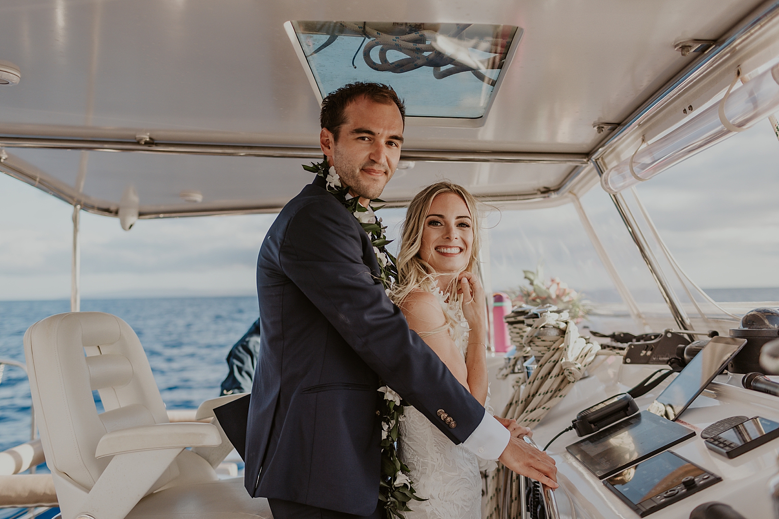 Bride and Groom on the navigation deck for the boat
